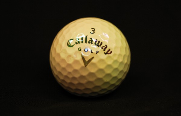 Self cleaning golf ball